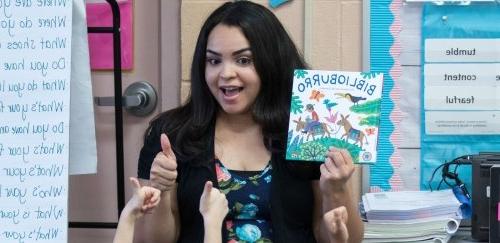 Teacher reading book to class